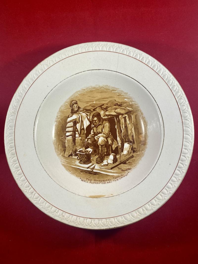 WW1 Bruce Bairnsfather 8.25” Commemorative Dish Depicting a Cooking Cartoon and the words THE HISTORICAL TOUCH – “WELL ALFRED OW ARE THE CAKES?”
