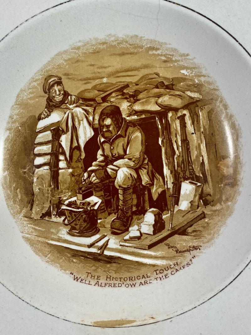 WW1 Bruce Bairnsfather 8.25” Commemorative Dish Depicting a Cooking Cartoon and the words THE HISTORICAL TOUCH – “WELL ALFRED OW ARE THE CAKES?”
